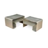 Two similar bent aluminium side tables,