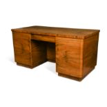 Attributed to Georg Gnaier, a German Art Deco walnut pedestal desk,