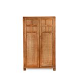 A Heal's limed oak Cotswold style fitted wardrobe circa1925,