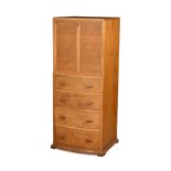 A Heal's style golden oak bow fronted drinks cabinet,