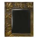 An Arts & Crafts style brass framed mirror,