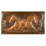 A large equestrian embossed copper plaque,