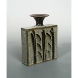 In the manner of David Leach, a slab form stoneware vase,