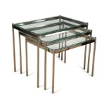 A nest of three glass topped chrome tables, circa 1970s,