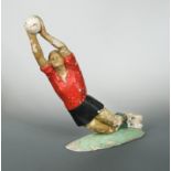 A mid-century plaster figure of a footballer,