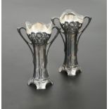 A pair of WMF Art Nouveau glass lined electroplate spill vases,