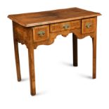 A George II walnut lowboy,