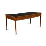 A large Regency double sided mahogany and boxwood library table,
