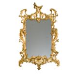 A carved rococo style giltwood mirror, 19th century,