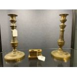 A pair of French gilt bronze candlesticks, early 19th century,