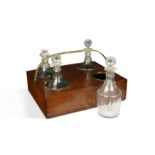 A mahogany decanter carrier with brass handles, in the George III style,