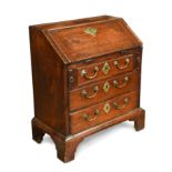 A small scale early George III fall fronted mahogany bureau,