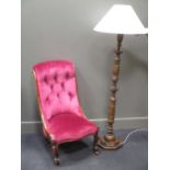 A Victorian nursing chair upholstered in pink velvet together with a papier maché standard lamp (2)