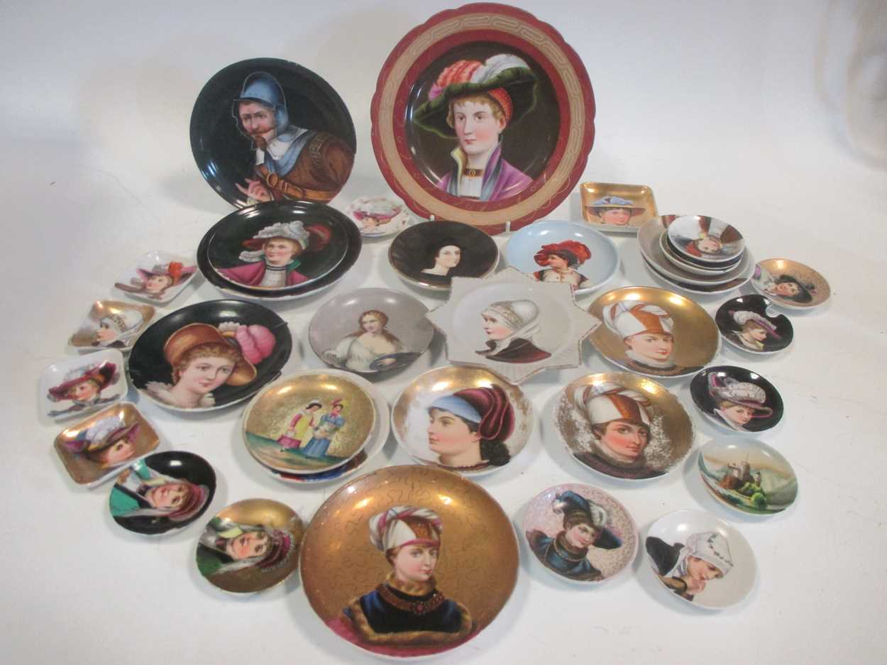 A collection of continental small cabinet plates variously decorated with portraits