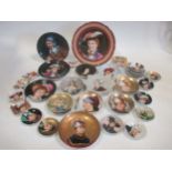 A collection of continental small cabinet plates variously decorated with portraits