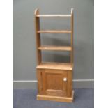 A miniature oak canted side hanging cabinet and set of pine shelves with cupboard below, 137 x 51