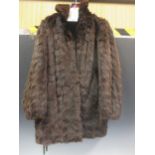 A lady's mink coat size 14