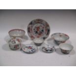 A group of 18th century Chinese porcelain to include a lobed saucer, a slop bowl decorated in puce