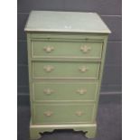 Green painted chest of drawers, fitted with a brushing slide above four long drawers, on bracket