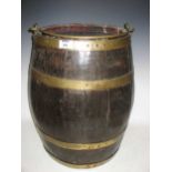 A 19th century barrel with a swing handle, a fishing rod, etc