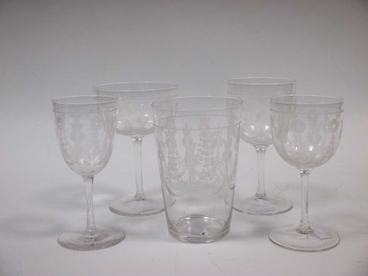 A collection of etched Edwardian glass stem ware