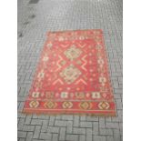 A kilim, 253 x 162cm and another wool rug, 220 x 98cm (2)