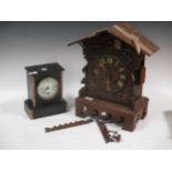 A late 19th century/early 20th century Black Forest cuckoo clock (A/F) and a marble and granite case