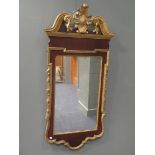 A George II style walnut and parcel gilt wall mirror