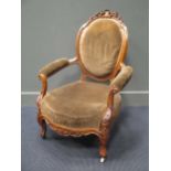 A pair of Victorian show frame easy chairs on cabriole legs