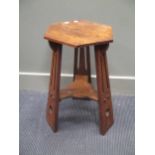 An Arts & Crafts oak occasional table 66cm high and 37cm wide