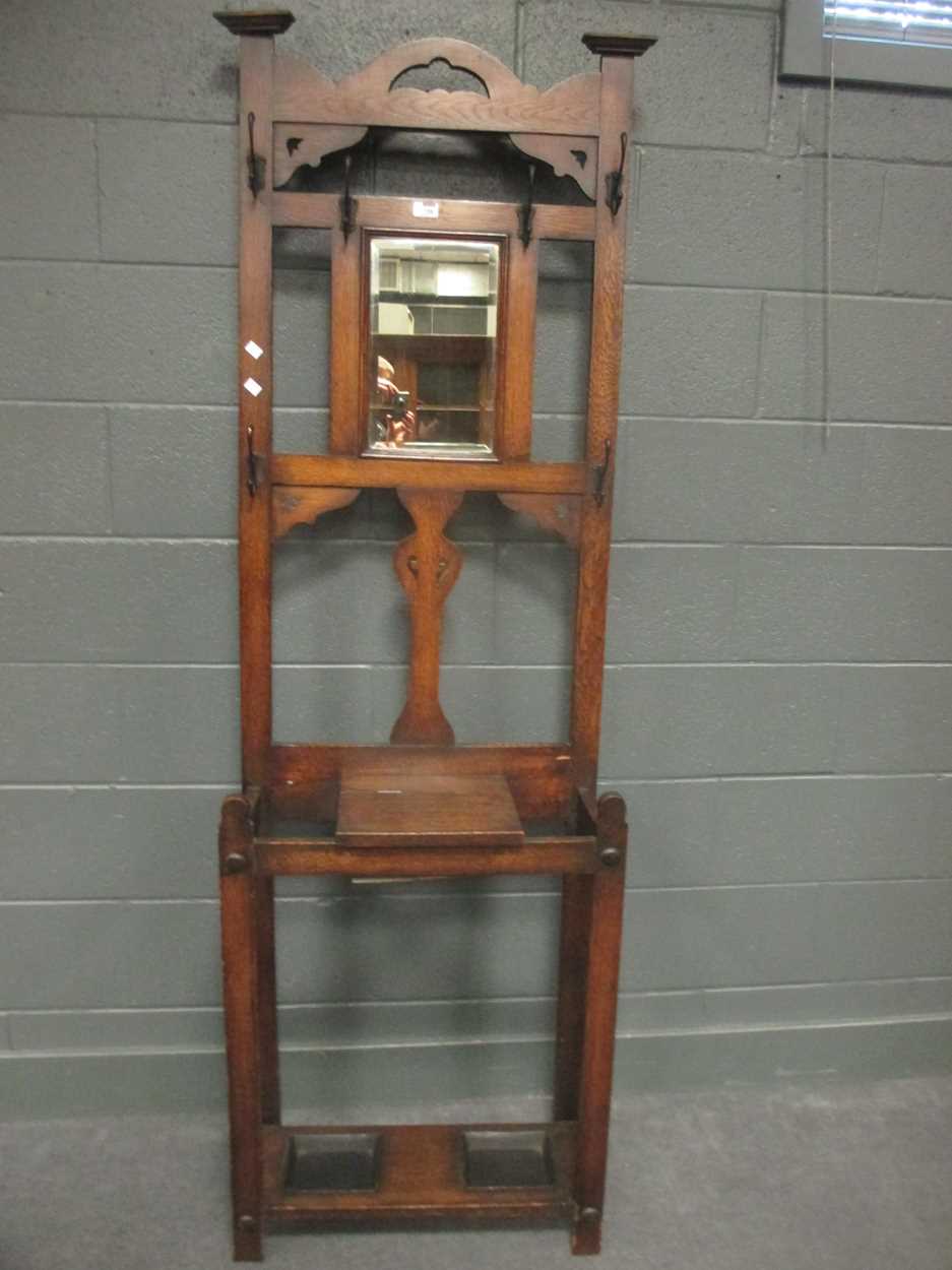 An early 20th century oak hall stand 195x 61x30cm