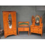 An early 20th century bedroom suite comprising wardrobe with Art Nouveau inlays, dressing table