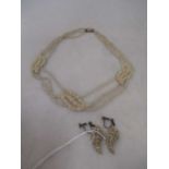 a three row floral seed pearl necklace with a mother-of-pearl reverse, together with a pair of