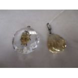 Quartz oval pendant with an insect and a pear shaped citrine pendant (2)