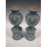 A pair of blue jasperware vases 38cm high
