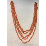 A five row coral bead necklace