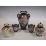 Three Noritake two-handled vases painted with sailing boats, reserved on blue ground bodies, the