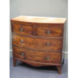 A 19th century mahogany bow fronted chest of drawers, with two short over three long cockbeaded
