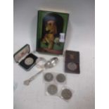 A small mixed collection of old coins, a silver napkin ring and a silver spoon