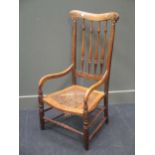 A cane seated armchair with high back