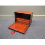 A George III mahogany table top cabinet with two internal drawers, brass side handles with key, 31 x