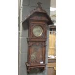 A late 19th century oak cased 8 day wall clock