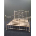 A Victorian style white painted brass double bed frame