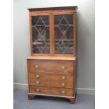 A 19th century mahogany secretaire bureau bookcase, the top section with a pair of astragal glazed