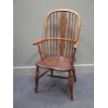 A 19th century elm and ash stick back Windsor elbow chair