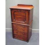 An early Victorian flame mahogany writing cabinet over four drawers with locking bar 115 x 66 x