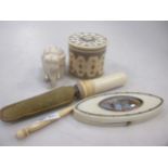 A small collection of ivory items to include a silver bladed apple corer, a George III needle