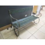 A green painted wood and metal slatted garden bench