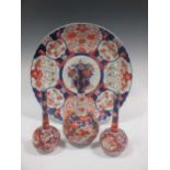 A large Japanese imari charger, 47cm diameter; three similar bottle vases (4)