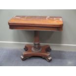 A George IV mahogany card table, the rounded rectangular top on an acanthus carved pillar 93cm wide